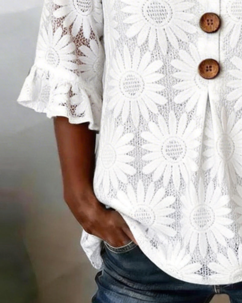 Blusa con estampado de margaritas y mangas con volantes