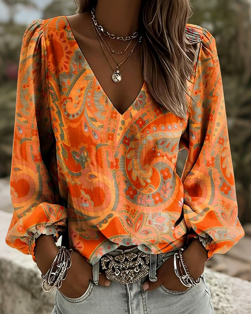 Blusa estampada con escote en V y mangas abullonadas