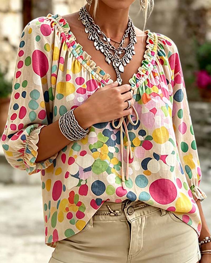 Blusa de escote en V con lunares y lazos