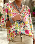 Blusa de escote en V con lunares y lazos