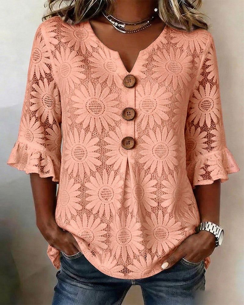Blusa con estampado de margaritas y mangas con volantes