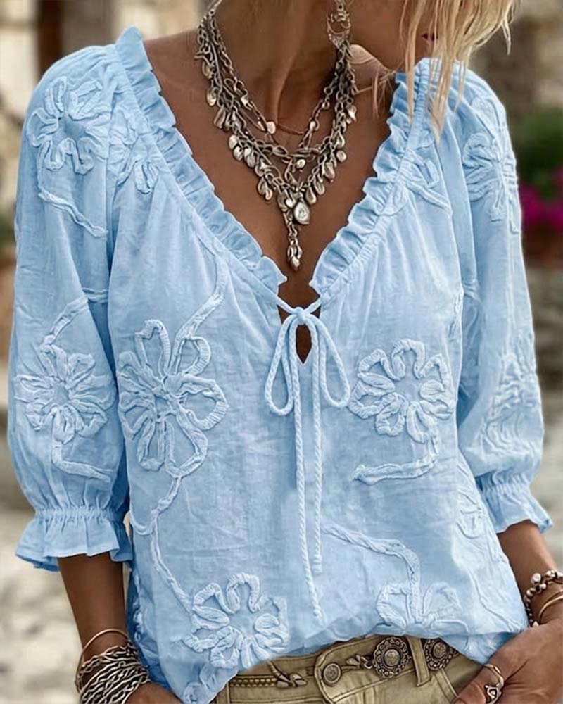 Blusa de algodón 100%, escote en V envolvente, con lazo y volantes