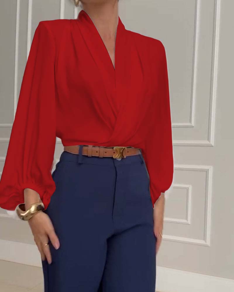Blusa de moda con mangas farol y escote en V de color sólido