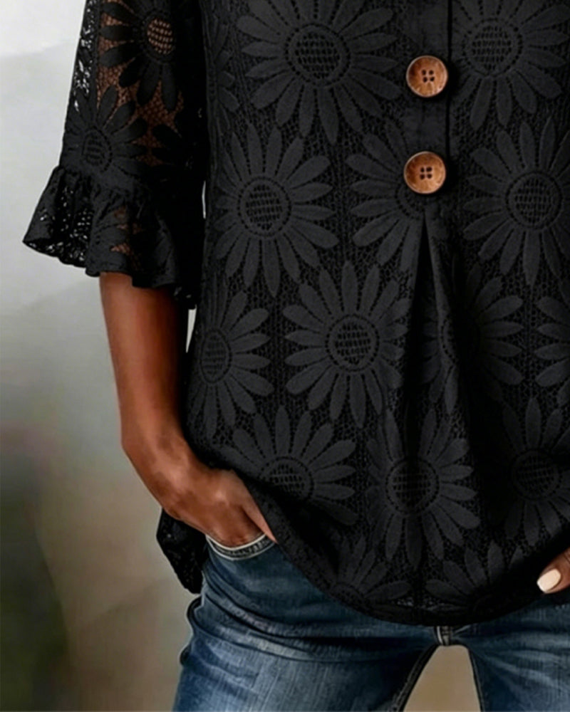 Blusa con estampado de margaritas y mangas con volantes