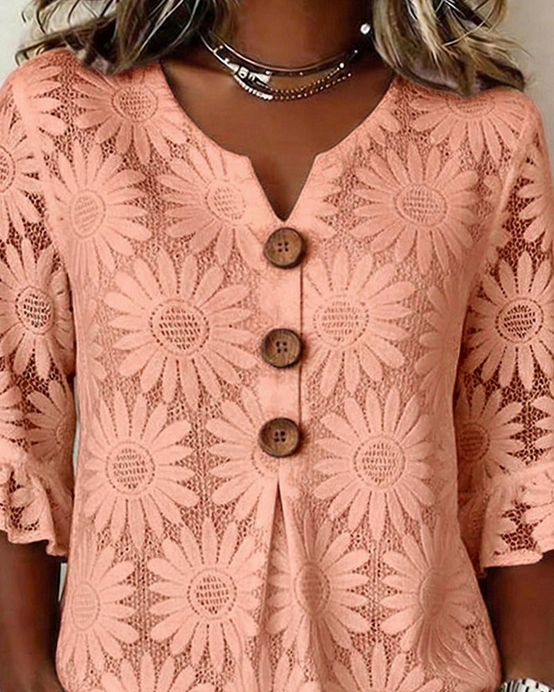 Blusa con estampado de margaritas y mangas con volantes