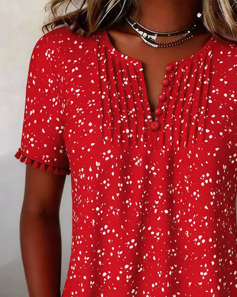 Blusa blanca de punto con flecos y mangas cortas