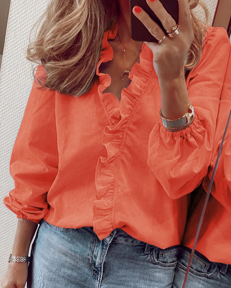 Blusa de color sólido con mangas abullonadas