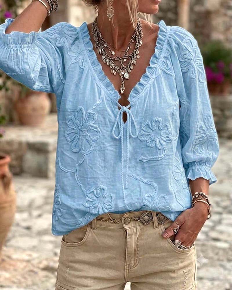 Blusa de algodón 100%, escote en V envolvente, con lazo y volantes