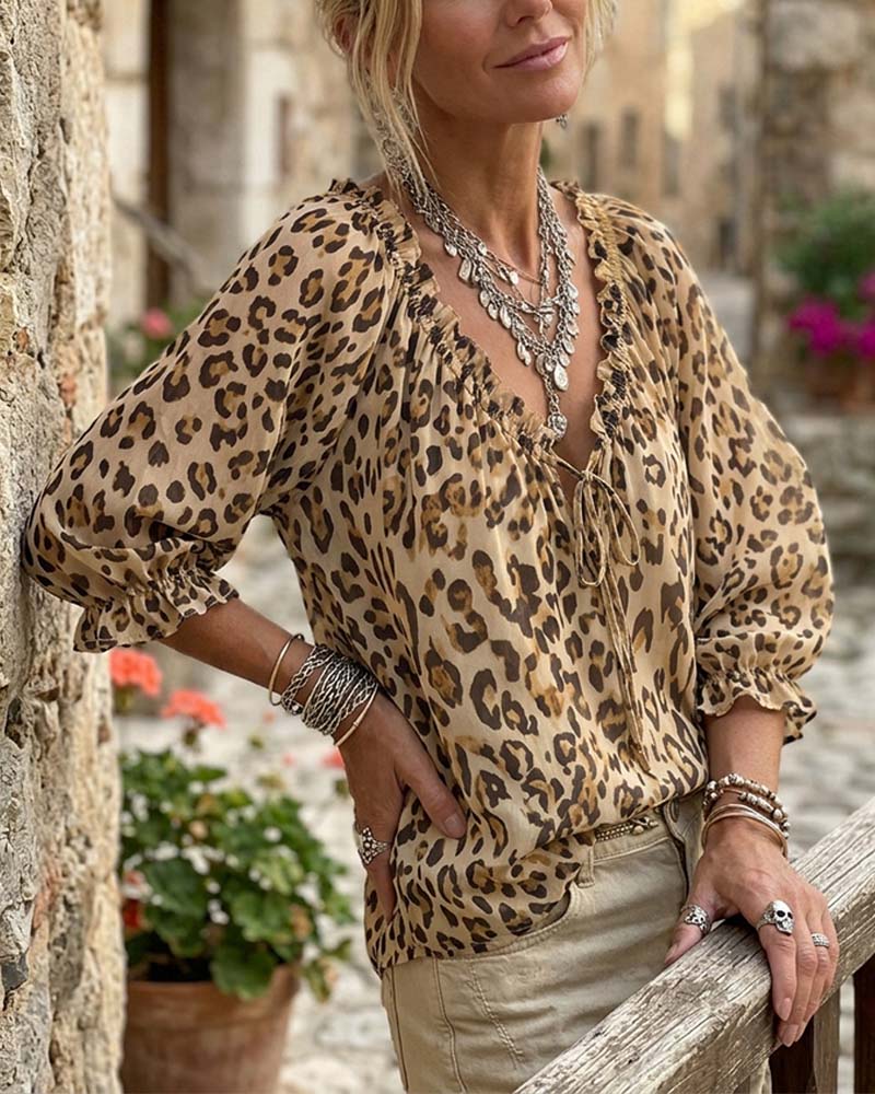 Blusa estampada de leopardo cuello en V mangas abullonadas con lazos
