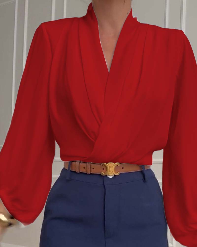 Blusa de moda con mangas farol y escote en V de color sólido