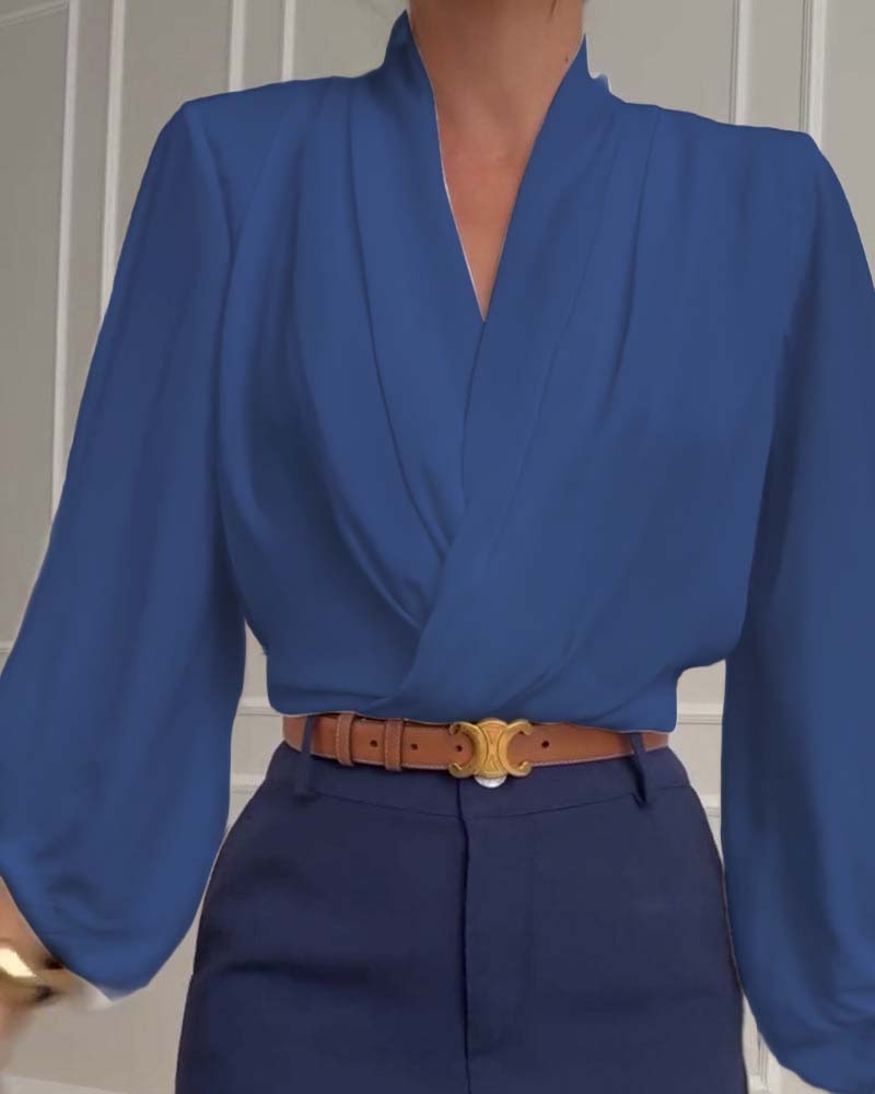 Blusa de moda con mangas farol y escote en V de color sólido
