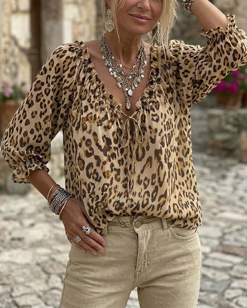 Blusa estampada de leopardo cuello en V mangas abullonadas con lazos