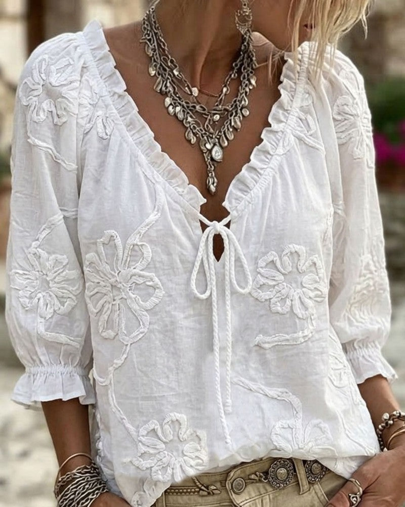 Blusa de algodón 100%, escote en V envolvente, con lazo y volantes