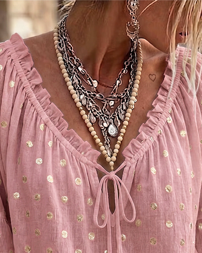 Blusa con escote en V y mangas acampanadas