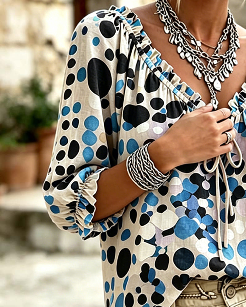 Blusa de escote en V con lunares y lazos