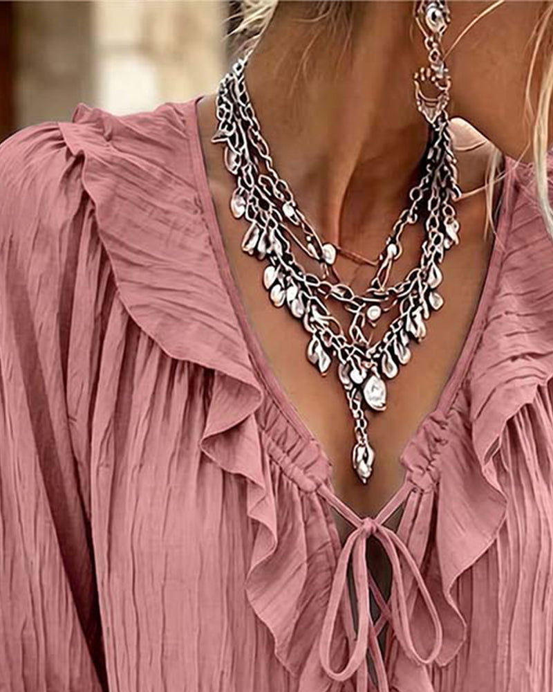 Blusa de manga larga con volante y ribete de encaje
