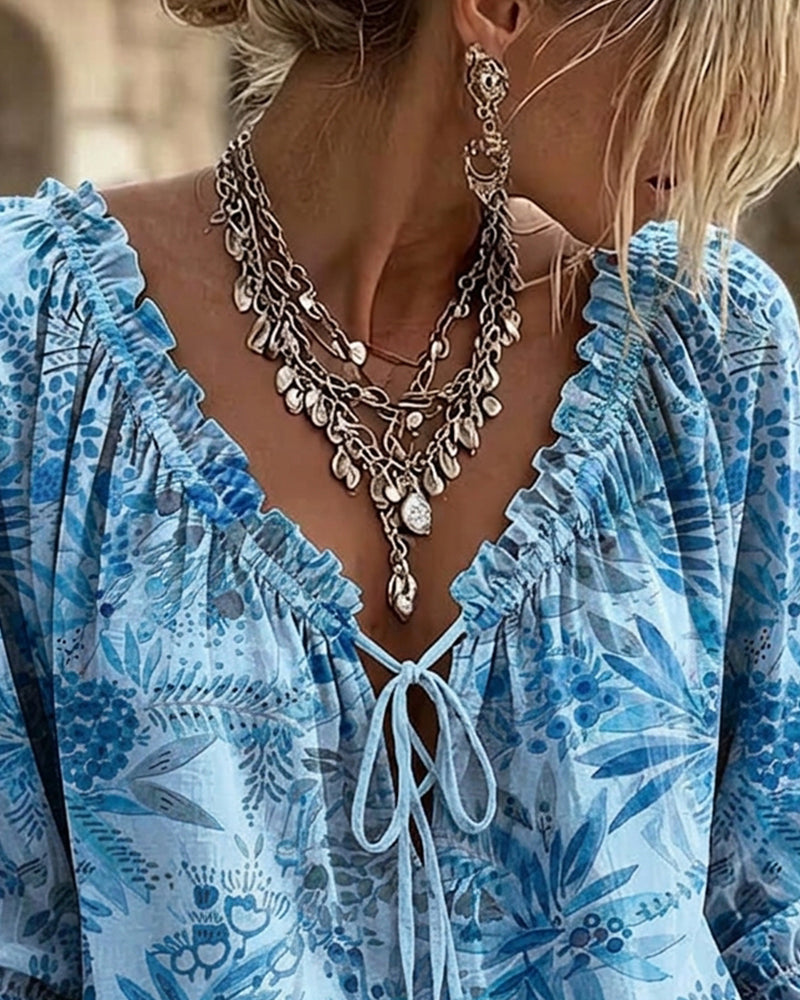 Blusa con escote en V y lazos