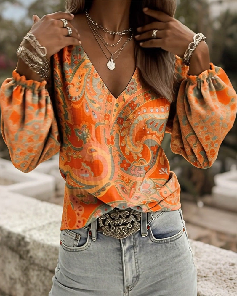 Blusa estampada con escote en V y mangas abullonadas