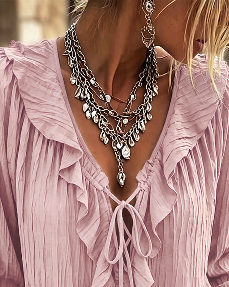 Blusa de manga larga con volante y ribete de encaje