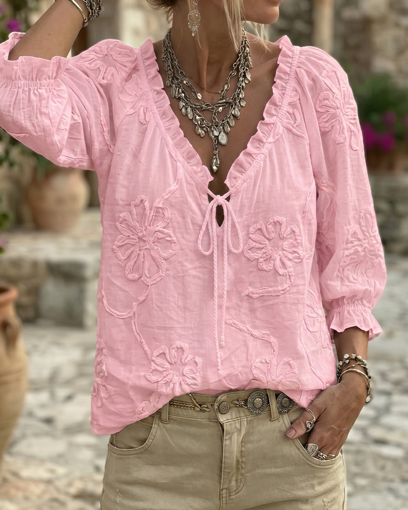 Blusa de algodón 100%, escote en V envolvente, con lazo y volantes