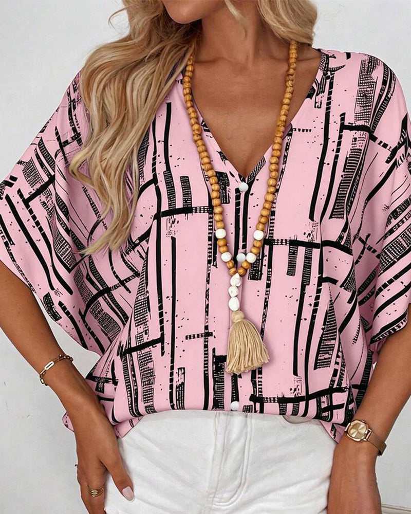 Blusa escote en V, corte recto, mangas murciélago