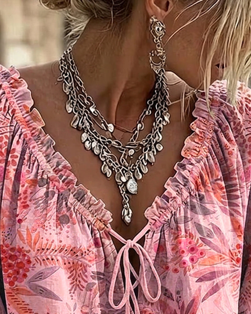 Blusa con escote en V y lazos