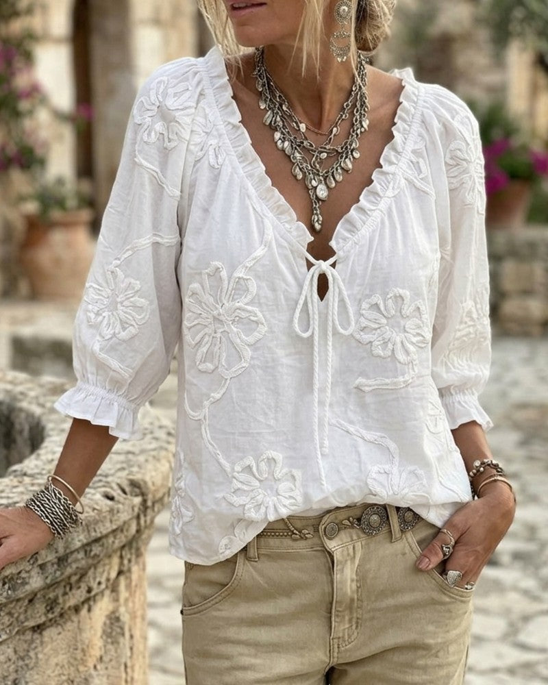 Blusa de algodón 100%, escote en V envolvente, con lazo y volantes