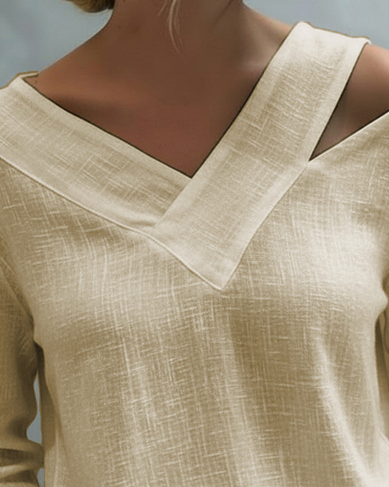 Top elegante con escote en V y tirante caído