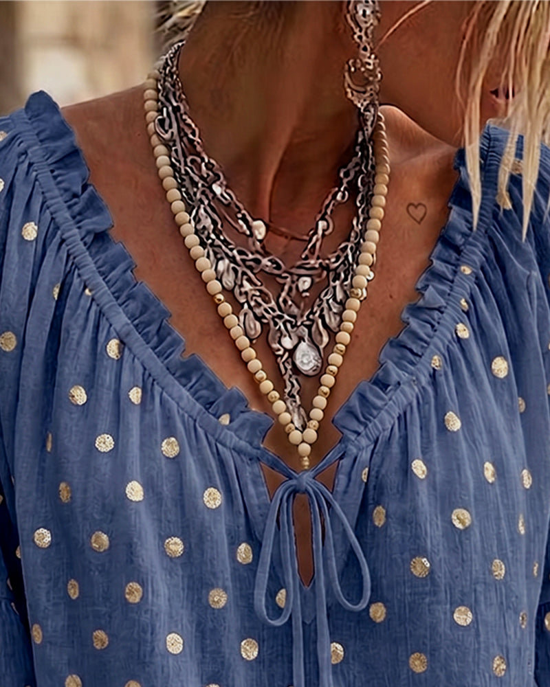 Blusa con escote en V y mangas acampanadas