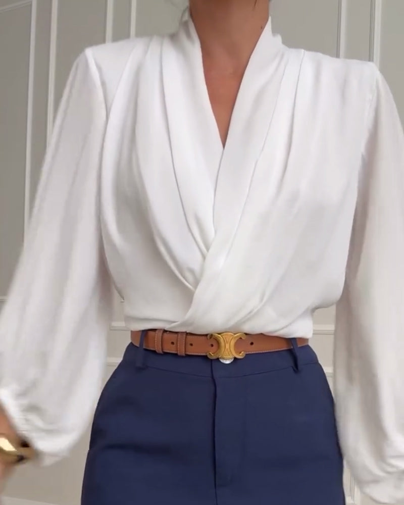 Blusa de moda con mangas farol y escote en V de color sólido