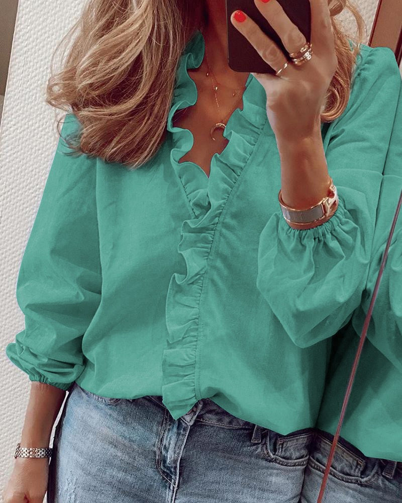 Blusa de color sólido con mangas abullonadas