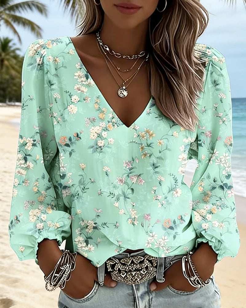 Blusa floral con cuello en V y mangas abullonadas