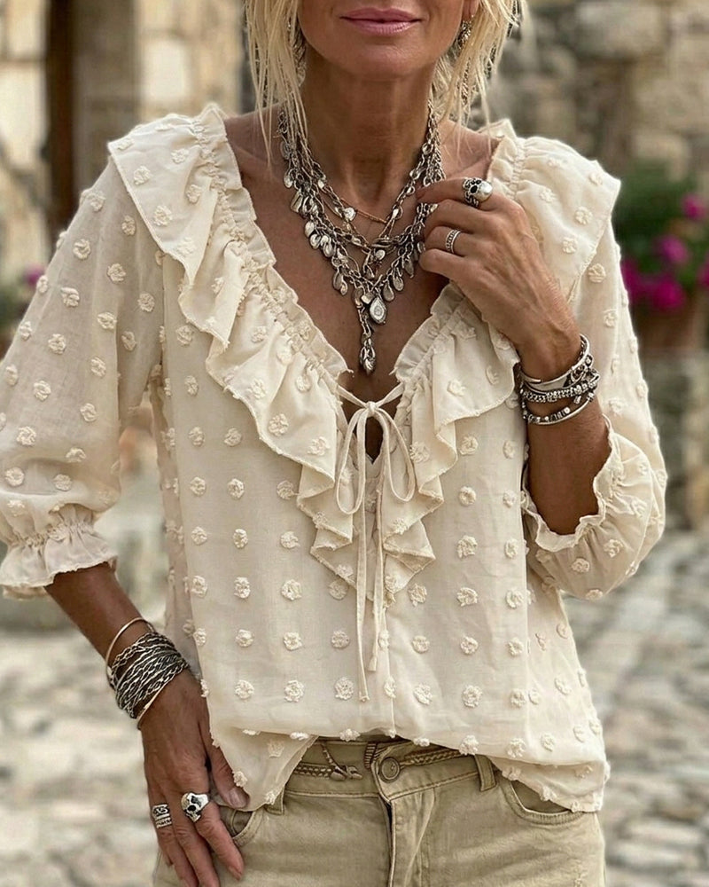 Blusa de jacquard con lunares y mangas globo, escote en V