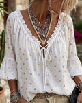 Blusa con escote en V y mangas acampanadas