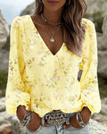 Blusa floral con cuello en V y mangas abullonadas