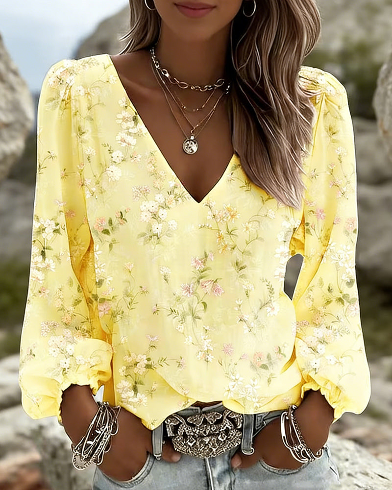 Blusa floral con cuello en V y mangas abullonadas
