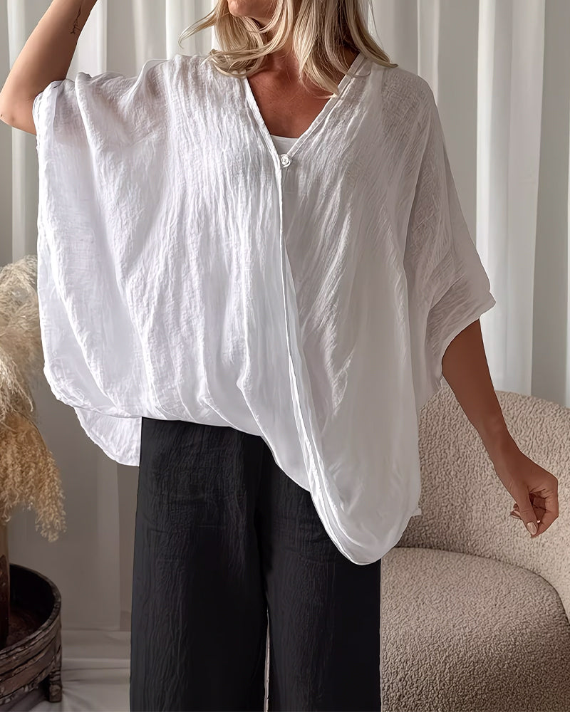 Blusa holgada de manga murciélago, color sólido