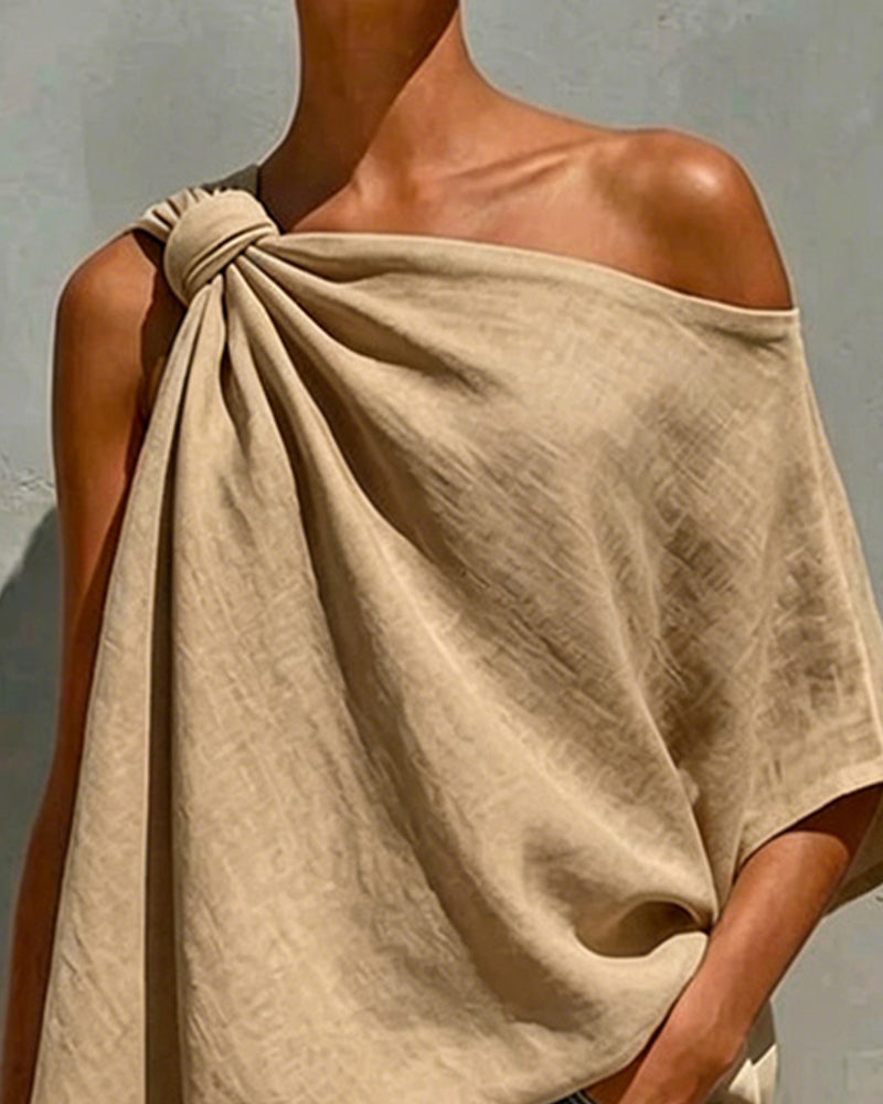 Blusa de un solo hombro con nudo asimétrico