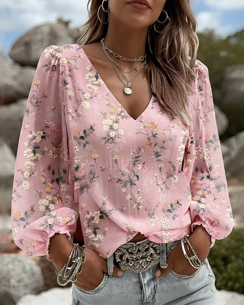 Blusa floral con cuello en V y mangas abullonadas