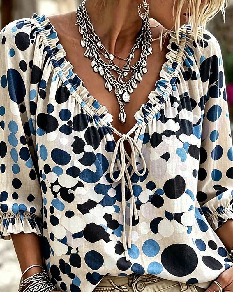 Blusa de escote en V con lunares y lazos