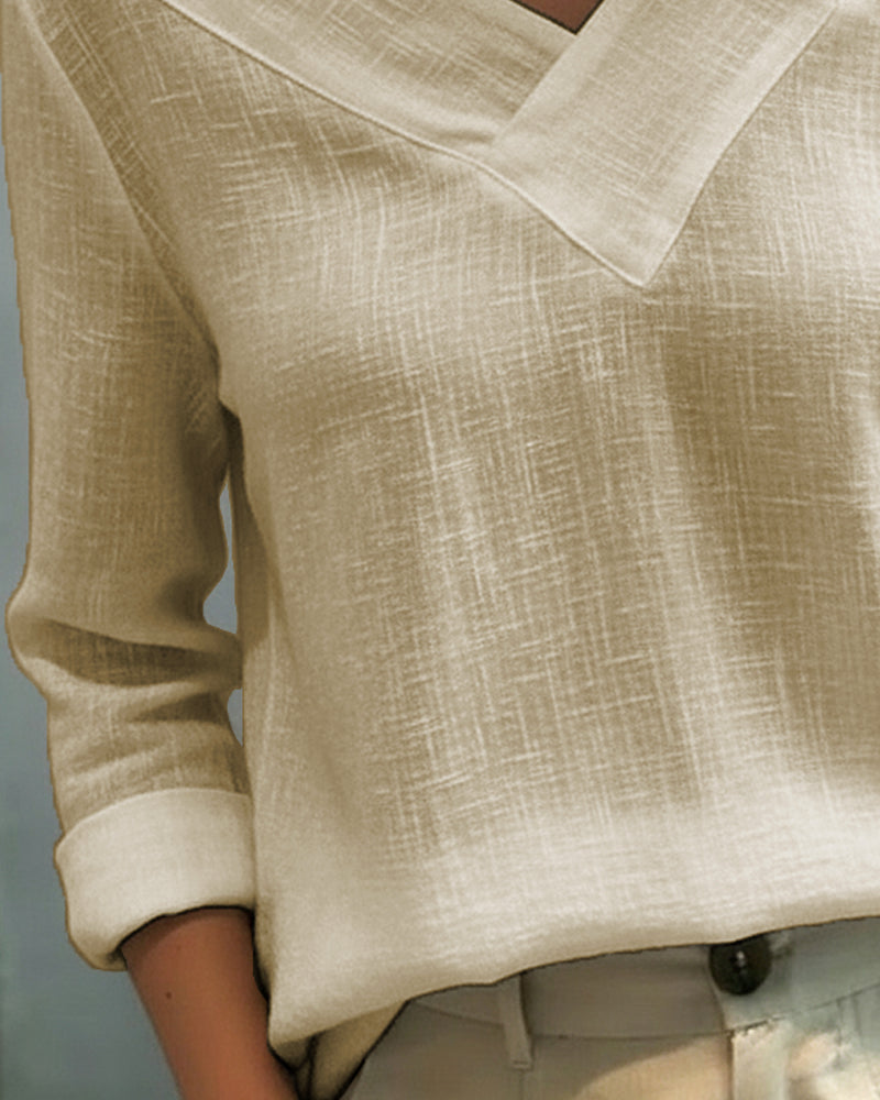 Top elegante con escote en V y tirante caído