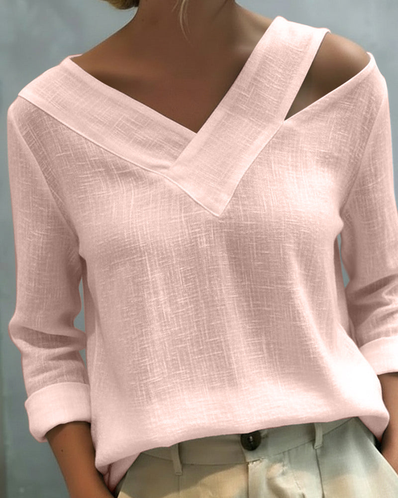 Top elegante con escote en V y tirante caído