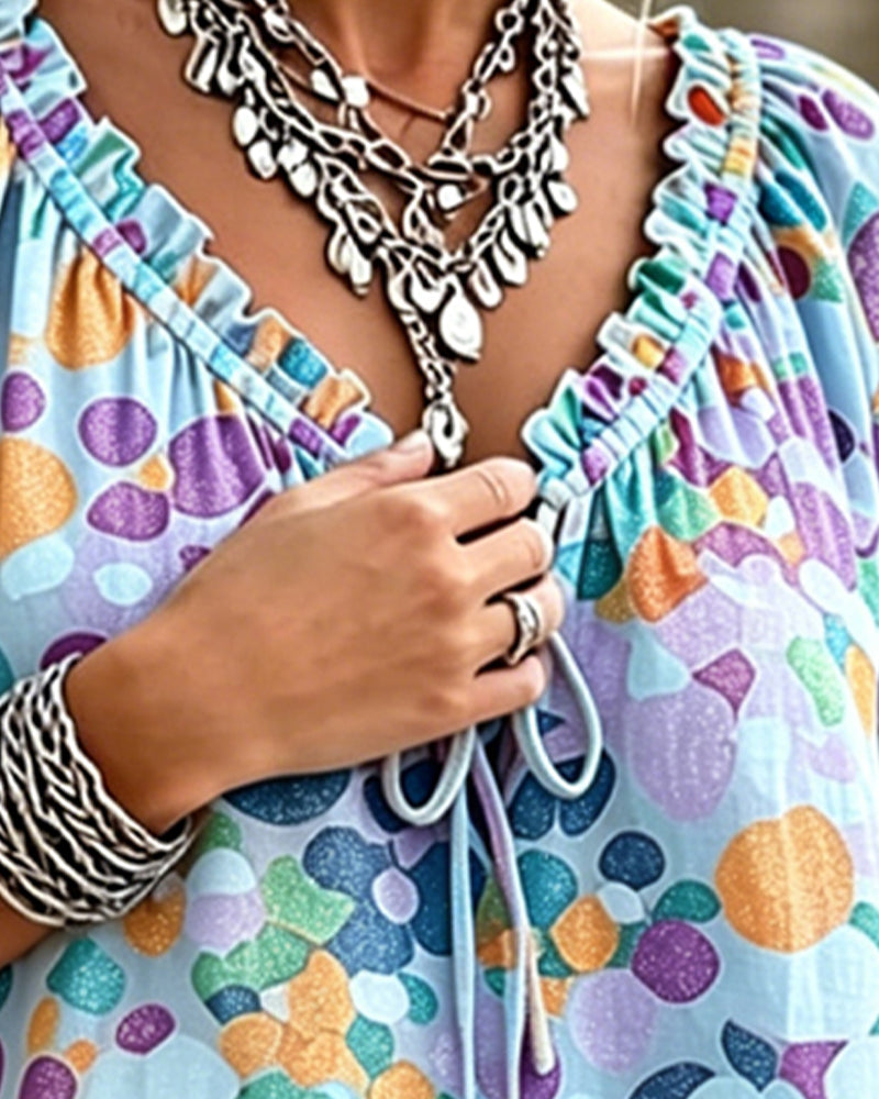 Blusa de escote en V con lunares y lazos