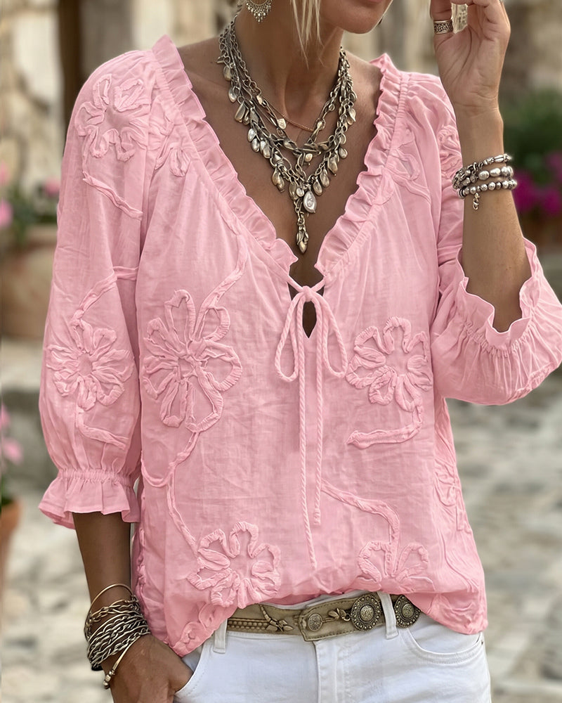 Blusa de algodón 100%, escote en V envolvente, con lazo y volantes