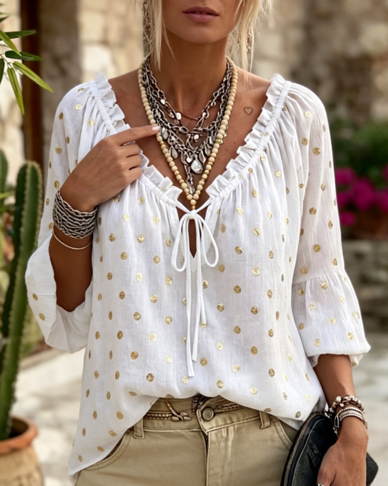 Blusa con escote en V y mangas acampanadas