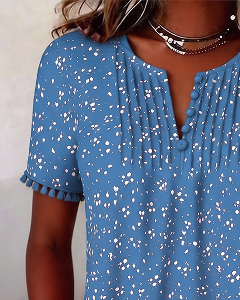 Blusa blanca de punto con flecos y mangas cortas