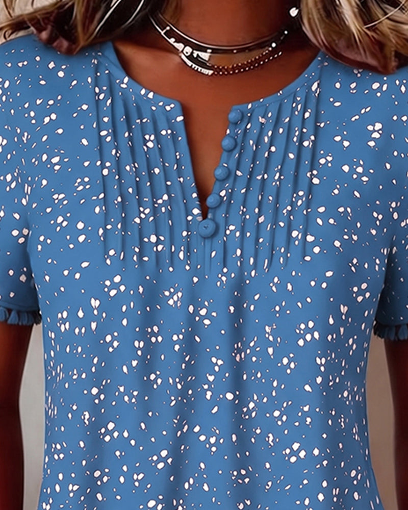 Blusa blanca de punto con flecos y mangas cortas