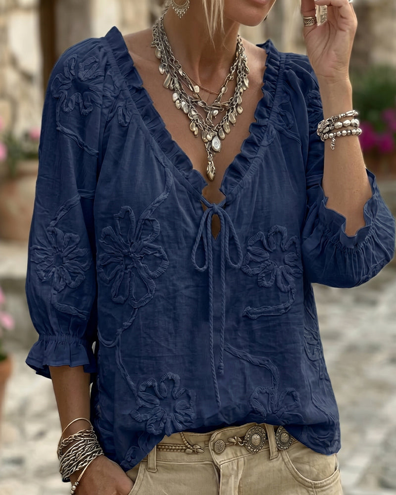 Blusa de algodón 100%, escote en V envolvente, con lazo y volantes