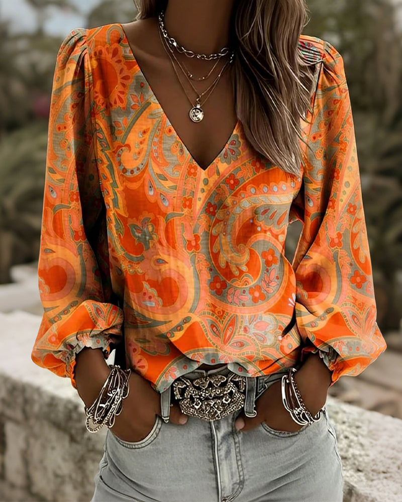 Blusa estampada con escote en V y mangas abullonadas