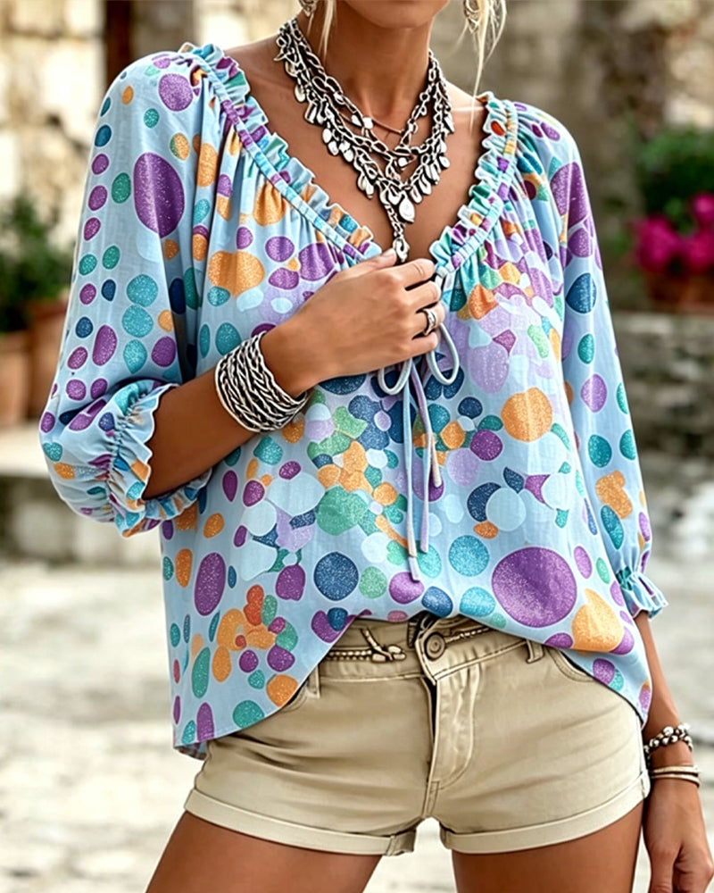 Blusa de escote en V con lunares y lazos
